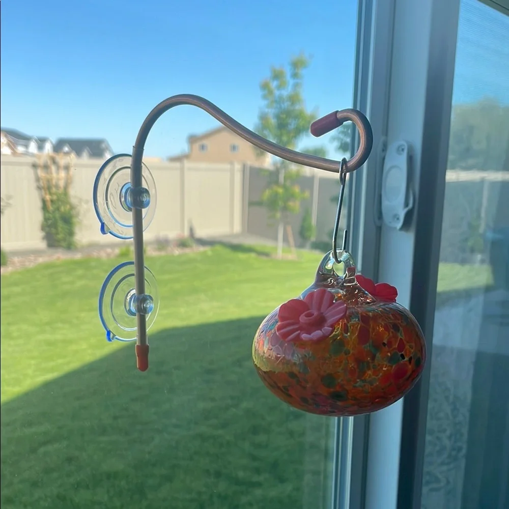 Orange and Red Bird Feeder with Ornate Design